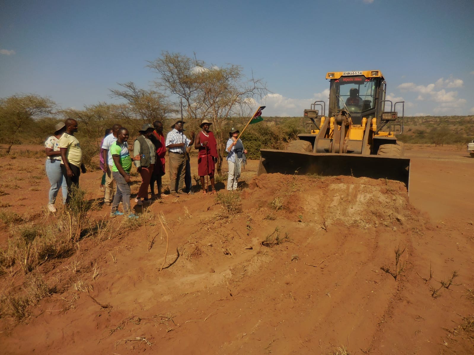 A field scenario of a water pan under construction – with foreigners eg. In Olkeri.